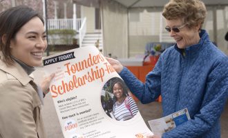 Image: Carter McDowell with Scholarship poster